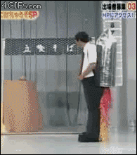 A really cool costume effect of a man pretending to be a rocket.