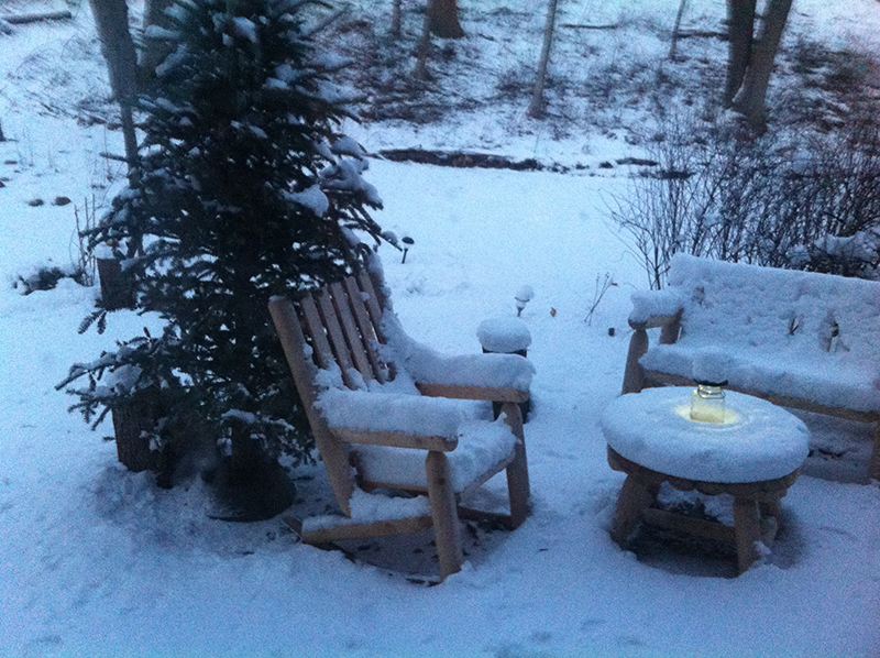 Thick snow outside, with a glowing solar light.