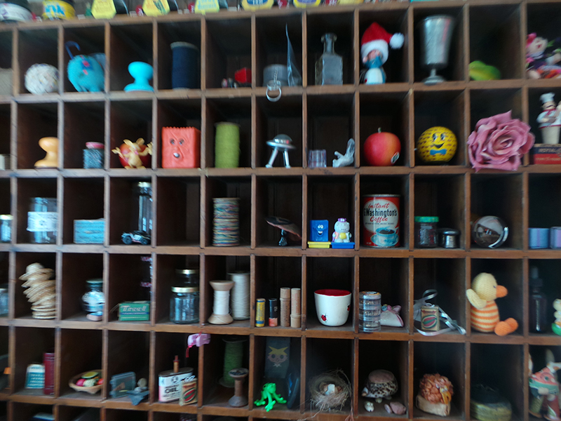 A close up of several different sections of a cubby wall I own.