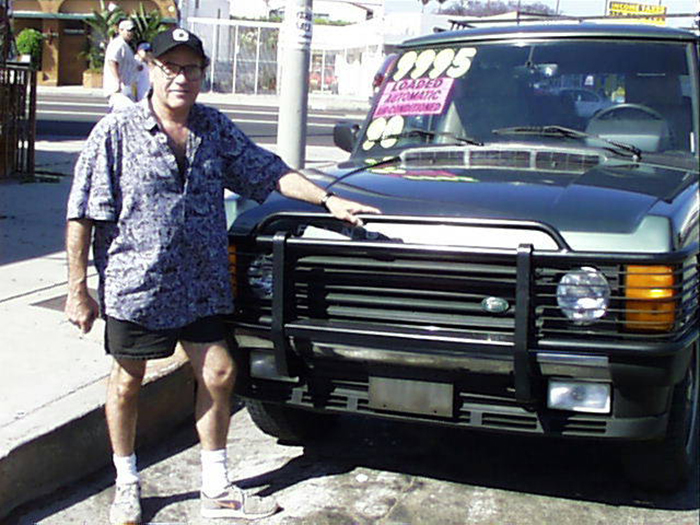 A 2001 photo of Bill in front of our Range Rover, which is now back on the East Coast.