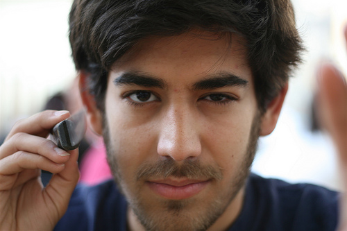 A photo of Aaron Swartz holding a knife at the camera. A photo of Aaron Swartz holding a knife at the camera.