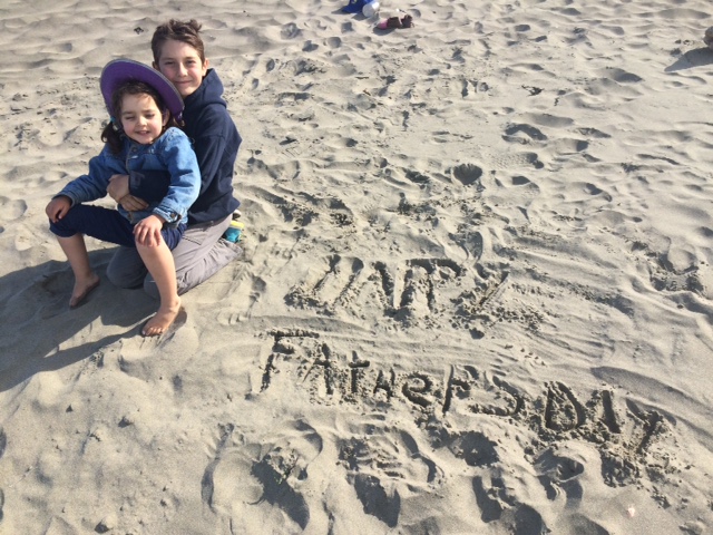 Marcus and Ilaria saying Happy Father's Day in the sand.